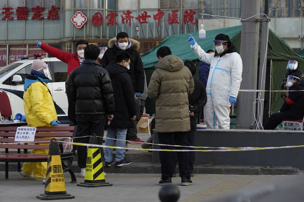 Residents line up for coronavirus tests at tents set up on the streets of Beijing on Sunday. Photo: AP