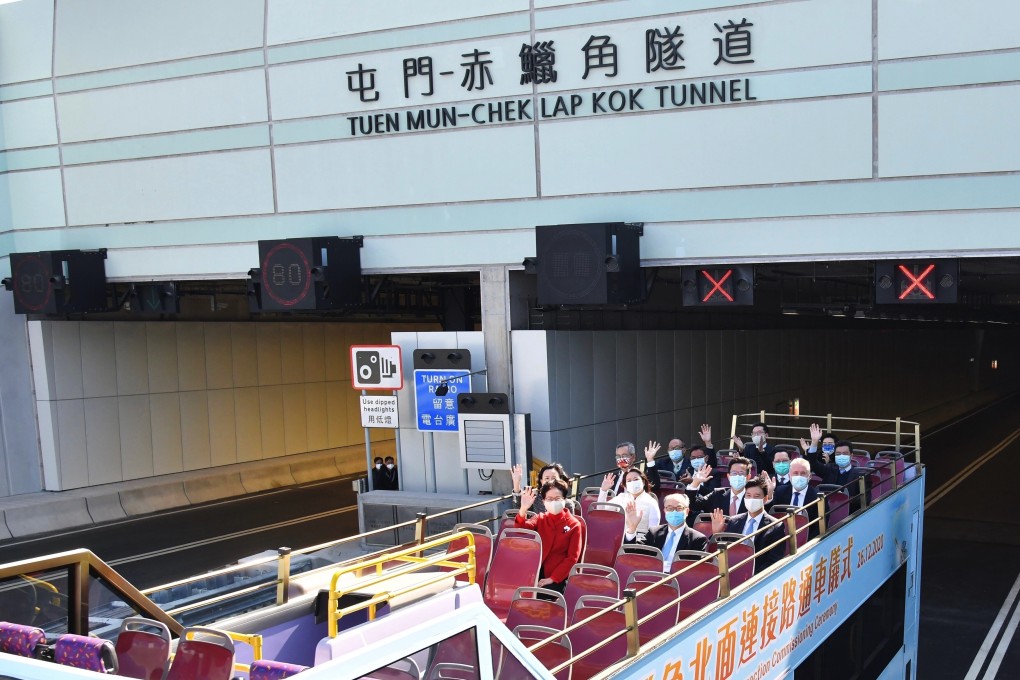 Chief Executive Carrie Lam (front, in red) and other officials ride a double-decker bus to attend a ceremony to mark the commissioning of the Tuen Mun-Chek Lap Kok Link Northern Connection, in Hong Kong on December 26. Photo: Xinhua