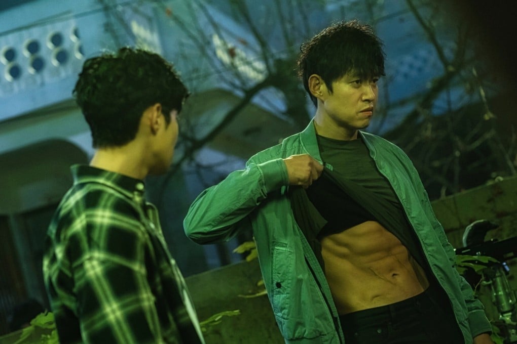 Yu Jun-sang (right), 51, who plays Mo-tak in The Uncanny Counter, shows off his abs in episode 5 of the Korean drama series now showing on Netflix.