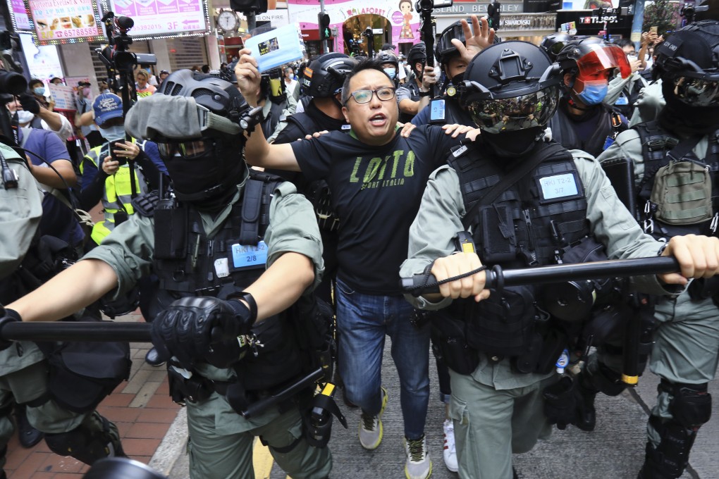 People Power activist Tam Tak-chi (centre) is arrested in Causeway Bay during an anti-government demonstration on May 24, 2020. Photo: May Tse