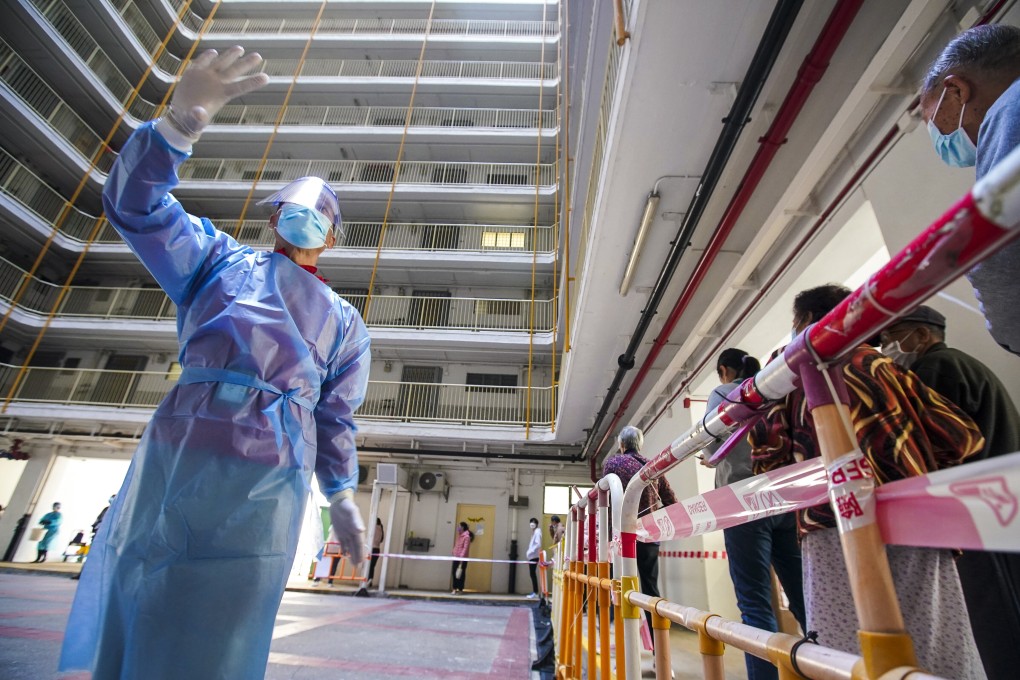 Swab samples are collected at a mobile Covid-19 testing point at Fung Chak House in Wong Tai Sin. Photo: Felix Wong