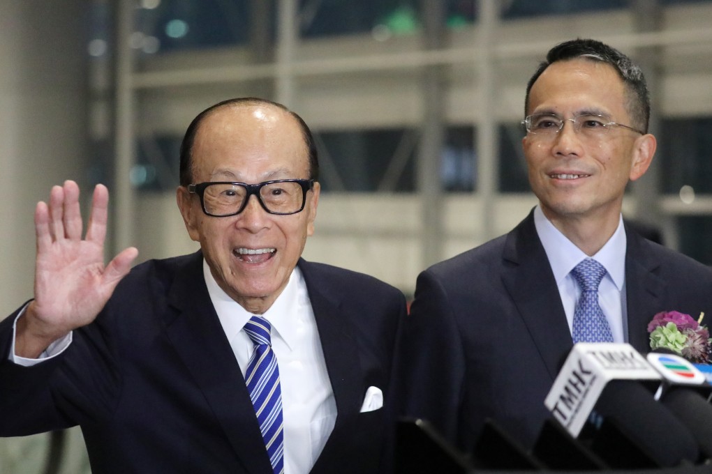 Li Ka-shing with his son, Victor Li Tzar-kuoi, at a company dinner in Wan Chai on January 10. Li is one of the four 90-somethings among Hong Kong’s 10 richest people. Photo: Dickson Lee
