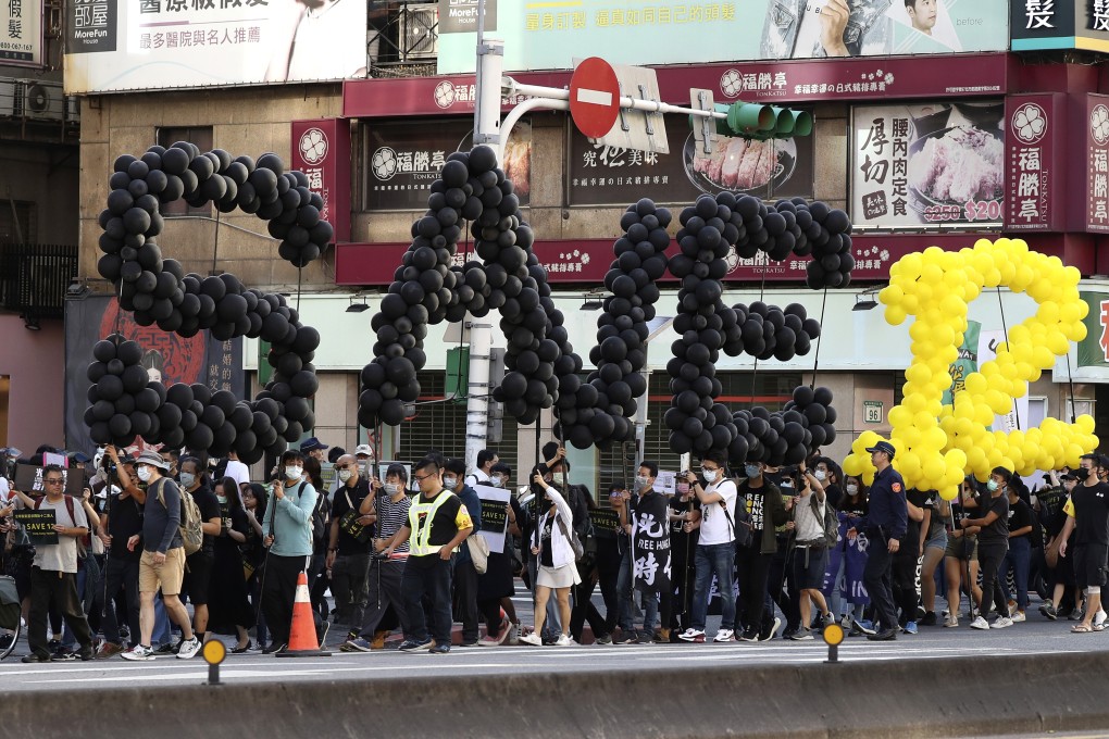 Supporters march in Taipei in October to demand the release of 12 Hong Kong protesters who had been arrested by Chinese authorities. Photo: AP