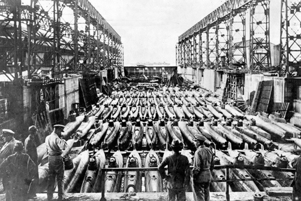 Members of a US military inspection team visit a dry dock at the Kure Naval Arsenal in Hiroshima. Photo: US Navy