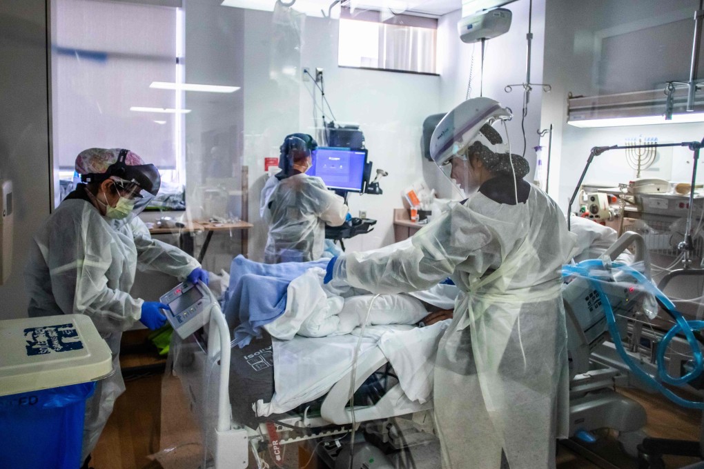 Nurses wearing personal protective equipment (PPE) attend to a Covid-19 patient in the Intensive Care Unit (ICU) at Providence Cedars-Sinai Tarzana Medical Center in Tarzana, California. Photo: AFP