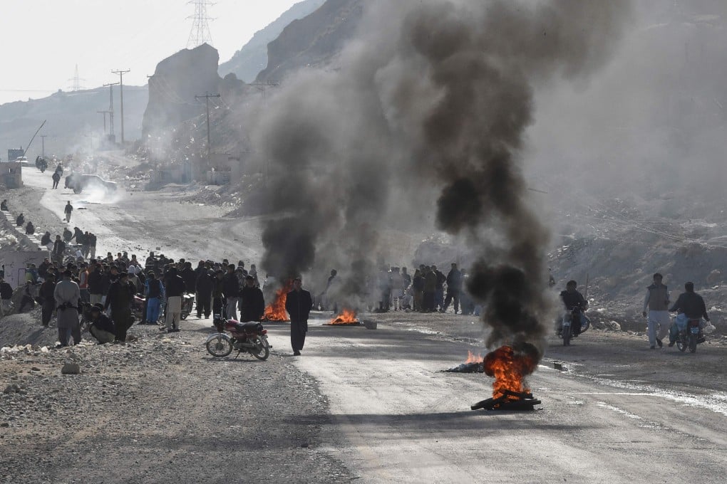Members of Shiite Hazara community burn tyres during a protest after the killing of 11 workers of their community, in Quetta, Pakistan on Sunday. Photo: AFP