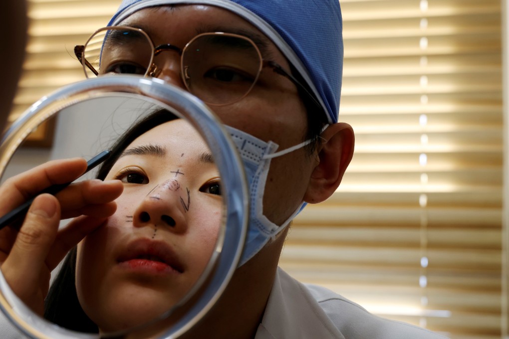 Ryu Han-na consults WooAhIn Plastic Surgery Clinic director Park Cheol-woo before undergoing cosmetic surgery on her nose in Seoul last month. Photo: Reuters