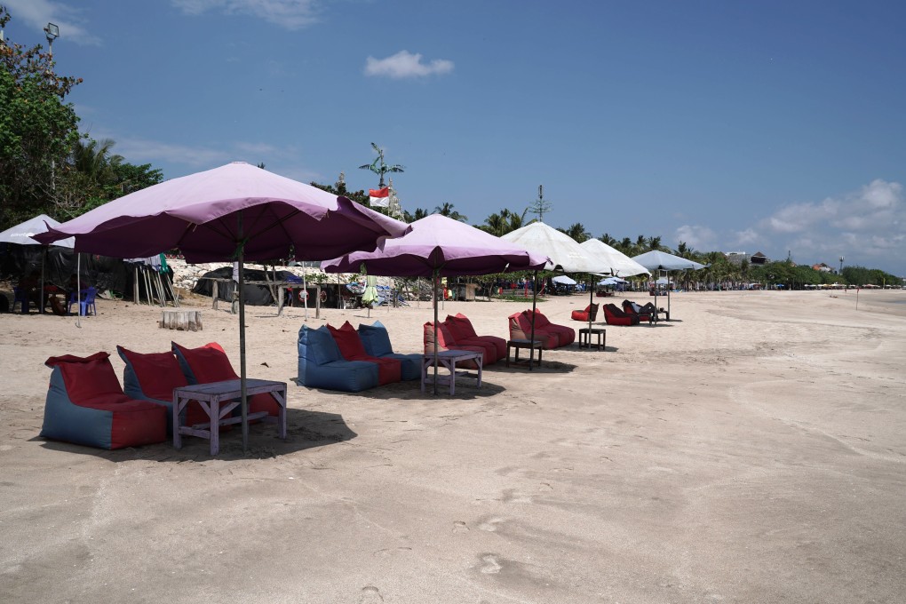 Empty chairs await tourists at Legian beach, Bali. Photo: Bloomberg