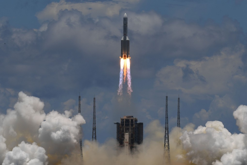 A Long March-5 rocket, carrying an orbiter, lander and rover as part of the Tianwen-1 mission to Mars, lifts off from Hainan province on July 23. Photo: AFP