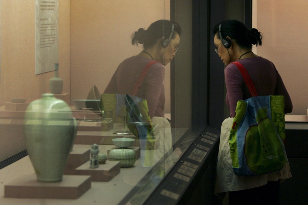 A visitor admires exhibits at the National Palace Museum in Taipei, Taiwan, in April 2009. The internationally renowned museum houses artefacts from China’s imperial era. Photo: AP