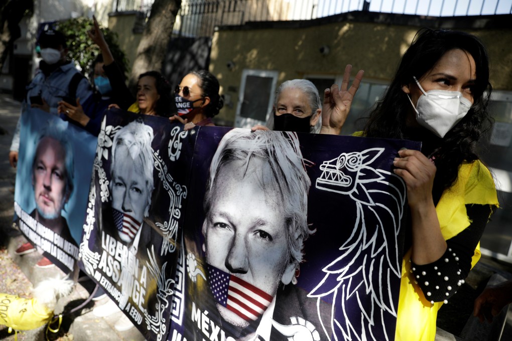 Demonstrators hold a banner displaying WikiLeaks founder Julian Assange during a protest outside the British embassy in Mexico City on Monday. Photo: Reuters