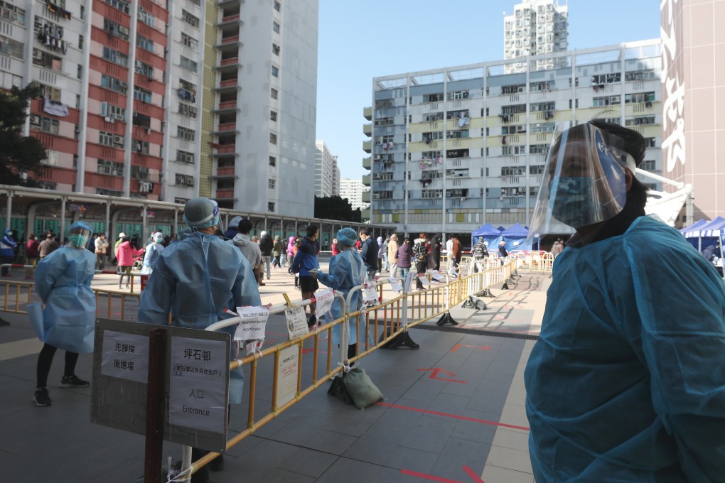 Residents of Ping Shek Estate wearing protective masks stand in line at a coronavirus testing centre in Choi Hung. Photo: Xiaomei Chen