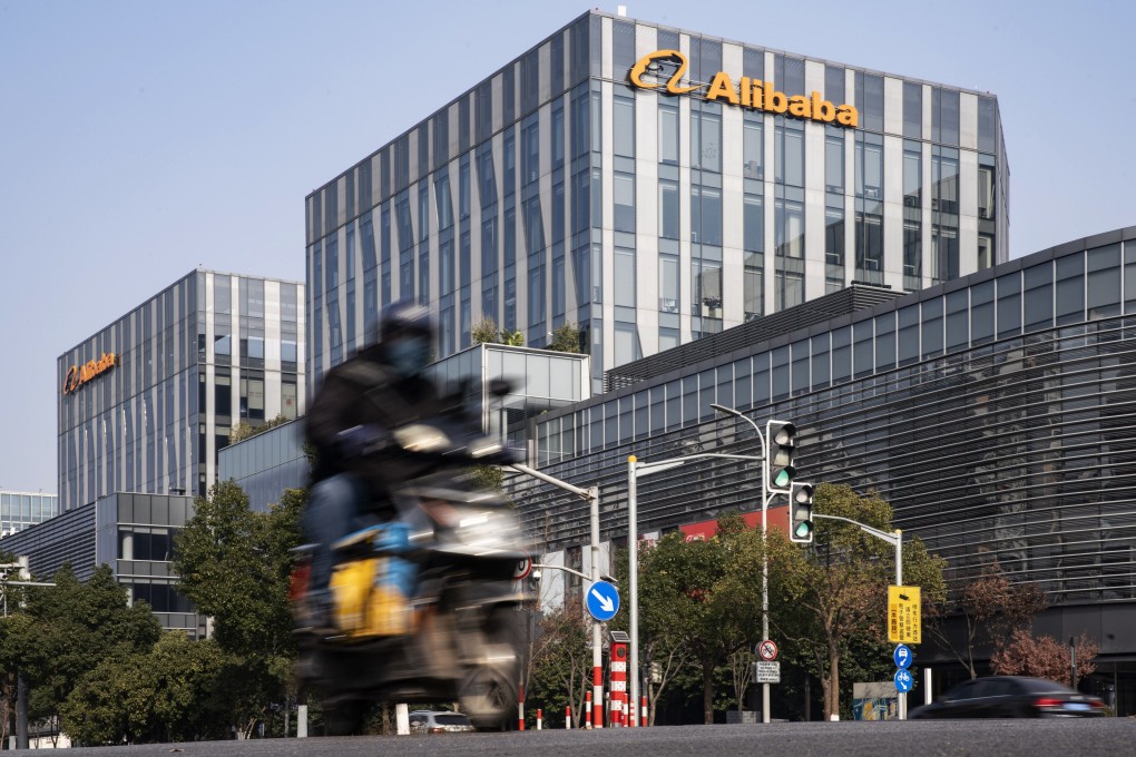 A motorist travels past an Alibaba Group office building in Shanghai on December 24. China’s shift towards antitrust measures against Alibaba’s Ant Group and other tech giants could signal the start of painful deleveraging for some of the country’s most successful firms. Photo: Bloomberg