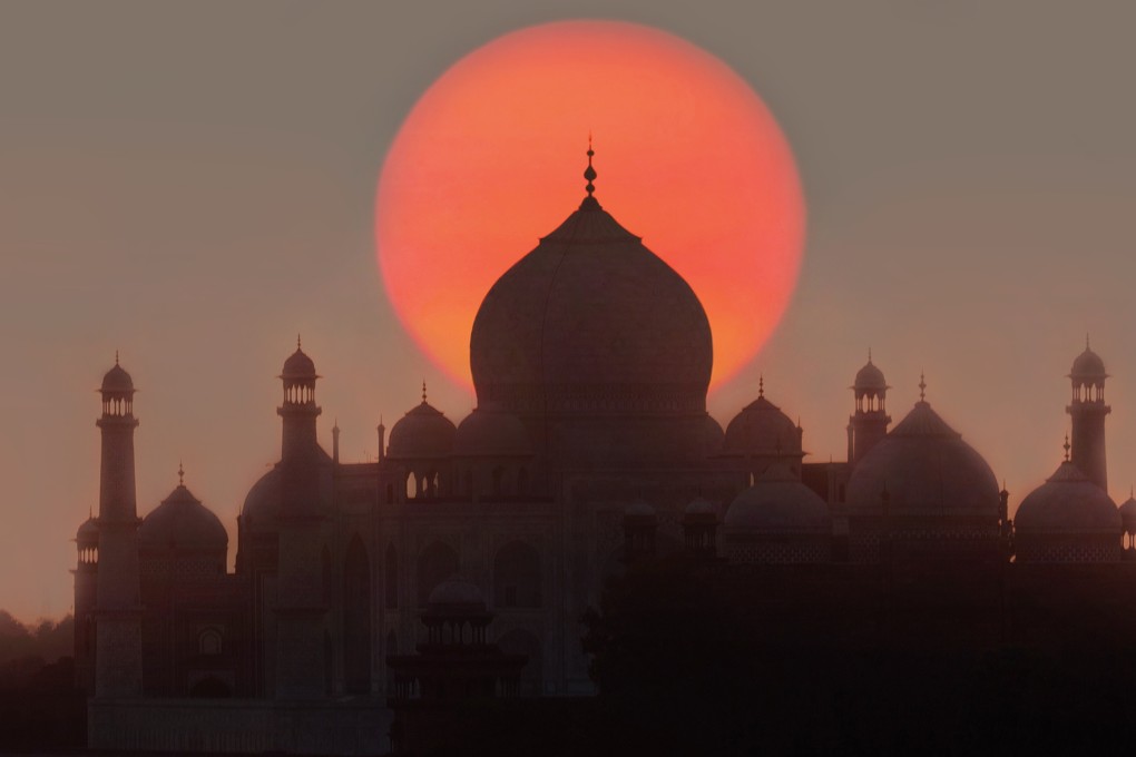Watching the sunrise over the Taj Mahal in Agra, Uttar Pradesh, India is just one of the bucket list trips travellers could try in 2021. Photo: Getty Images