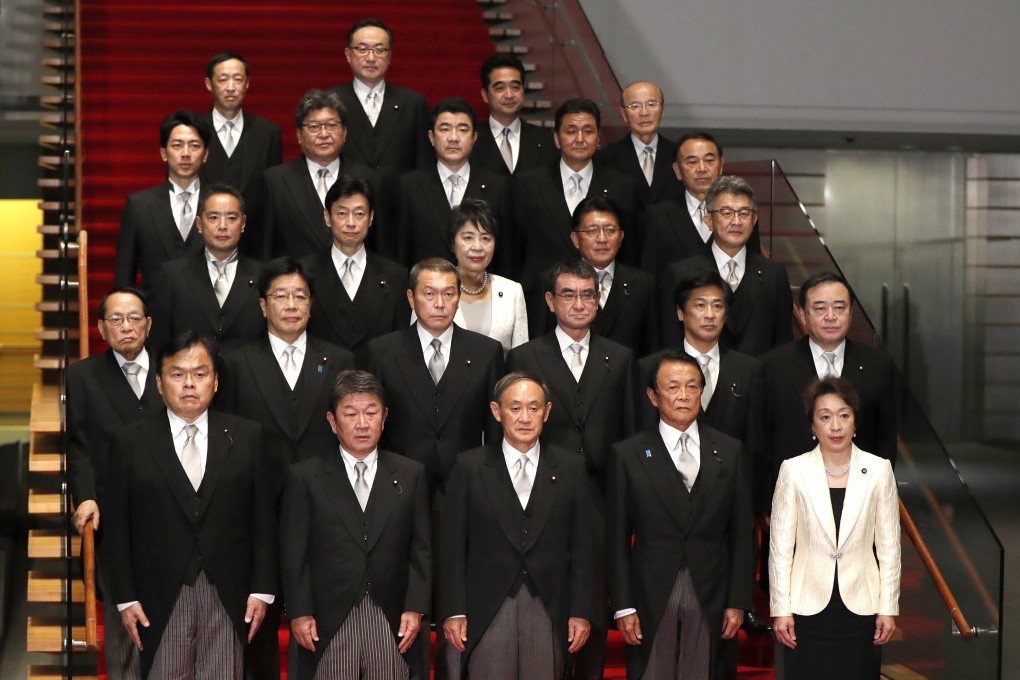 The cabinet of Prime Minister Yoshihide Suga, front centre, has just two women: Olympics Minister Seiko Hashimoto, bottom right, and Justice Minister Yoko Kamikawa, centre of the third row. Photo: AP