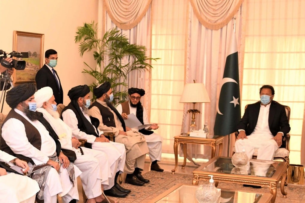 A delegation of Afghan Taliban meets Pakistani Prime Minister Imran Khan (right) in Islamabad on December 18. Khan has urged US President-elect Joe Biden to follow his predecessor’s example in handling Afghanistan. Photo: EPA-EFE