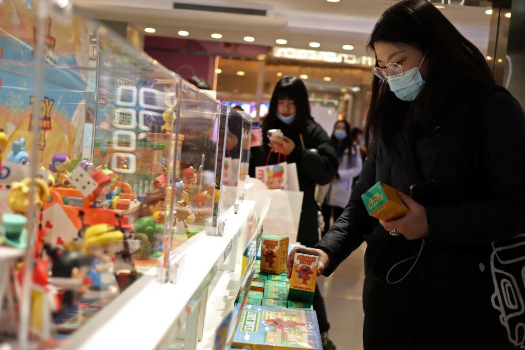 Consumers browse at Chinese toymaker Pop Mart’s outlet inside a shopping centre in Beijing. Photo: Reuters