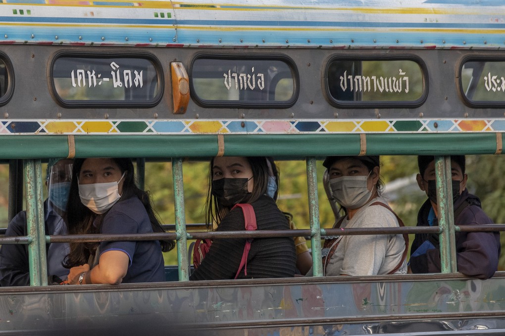 Migrant workers and their families are carried in trucks to a field hospital for Covid-19 patents in Samut Sakhon on January 4. Photo: AP