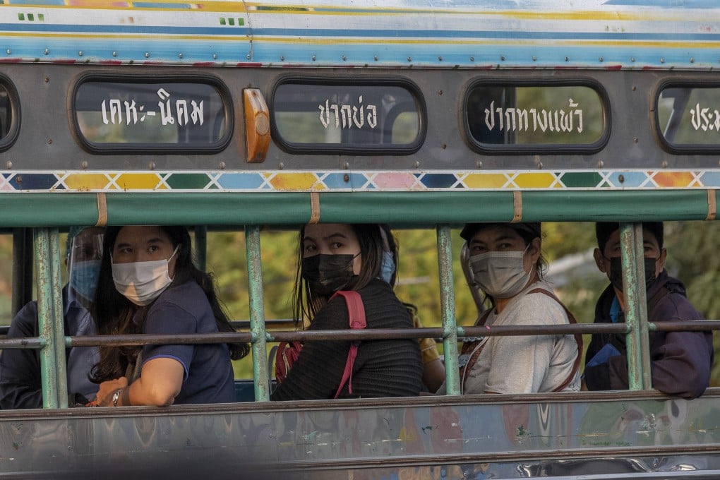 Migrant workers and their families are carried in trucks to a field hospital for Covid-19 patents in Samut Sakhon on January 4. Photo: AP