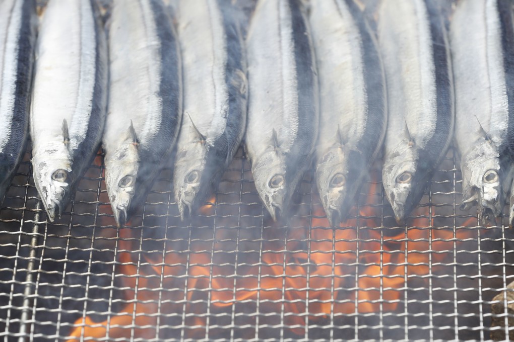 Saury on the grill at a festival for the fish in Tokyo. Photo: Kyodo