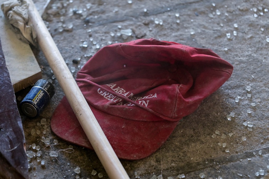 Debris including a “Make America Great Again” hat is cleaned up at the US Capitol after a violent incursion by supporters of Donald Trump. Photo: Reuters