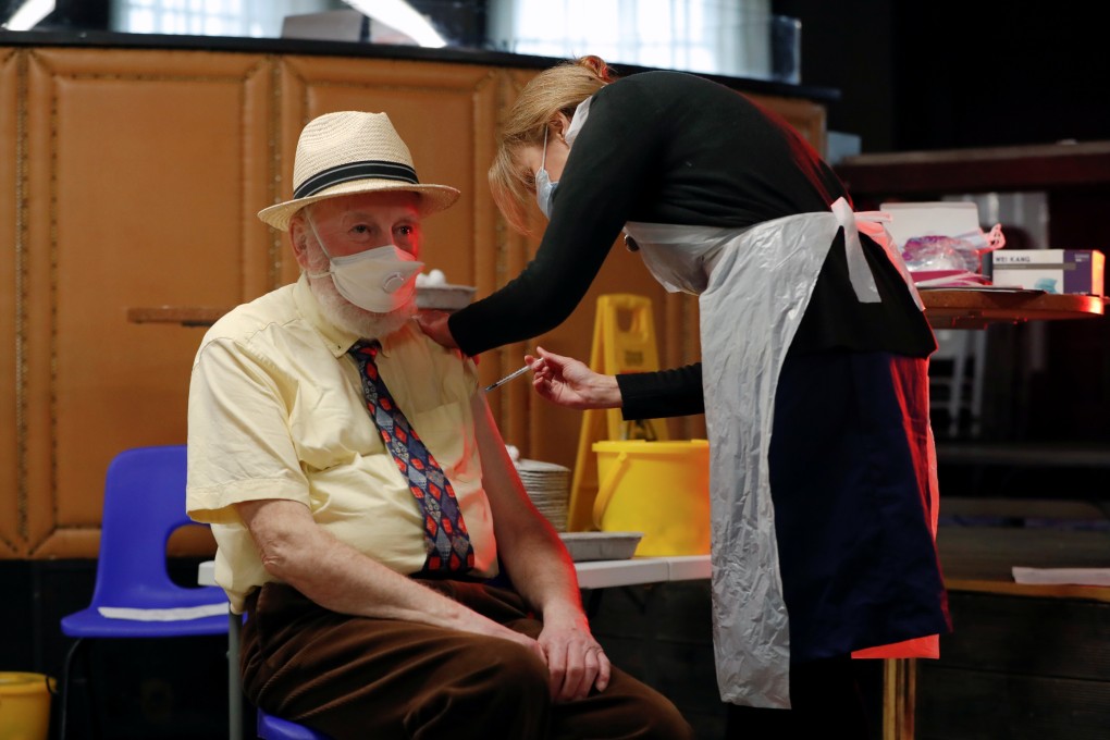 A man receives the Pfizer-BioNTech Covid-19 vaccine on Friday in St Albans, Britain. Photo: Reuters