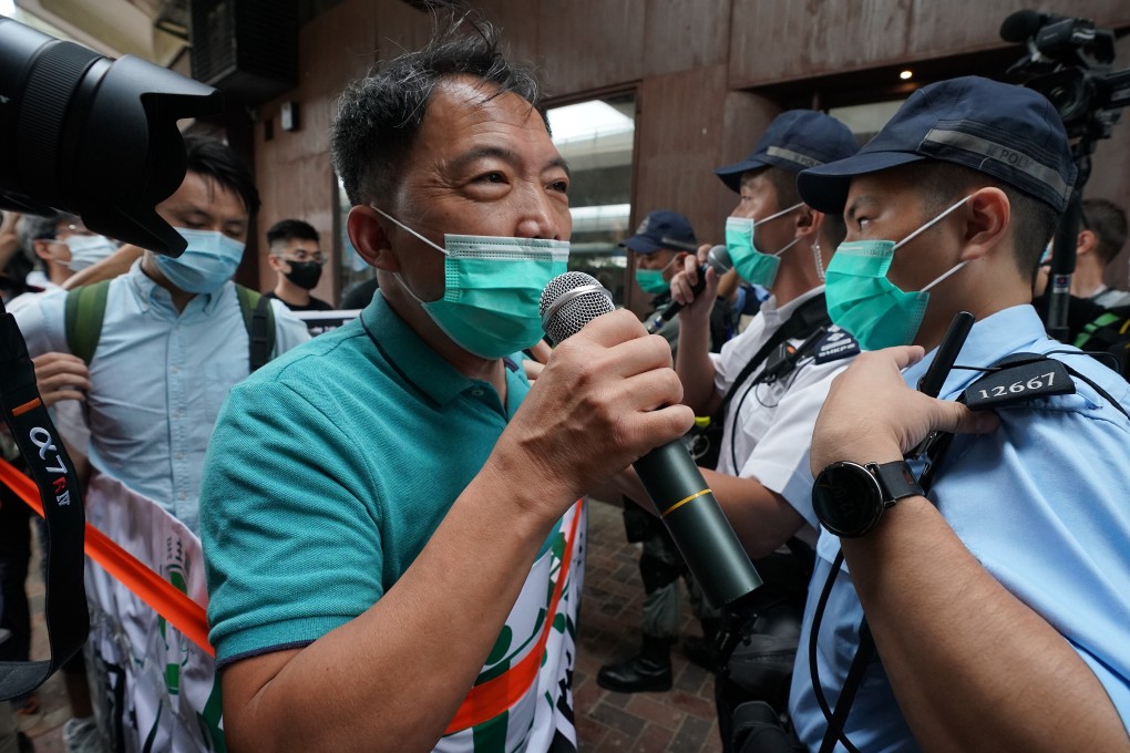 Police officers attempt to block former lawmaker Wu Chi-wai from marching towards Beijing’s liaison office in the city last May. Photo: Felix Wong
