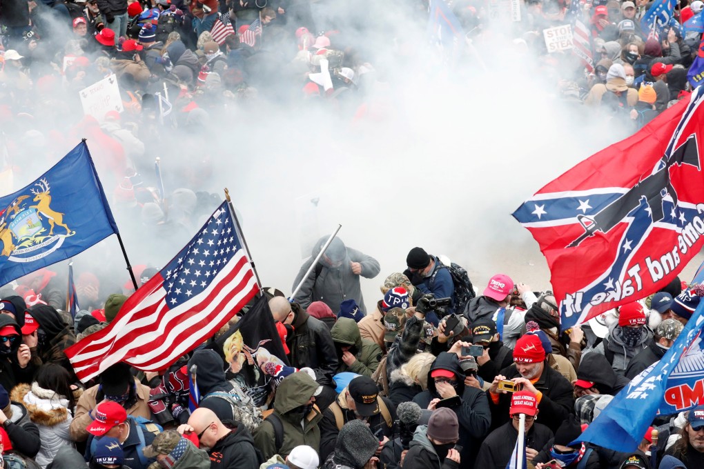 Tear gas is released into a crowd of protesters during clashes with Capitol police. Photo: Reuters