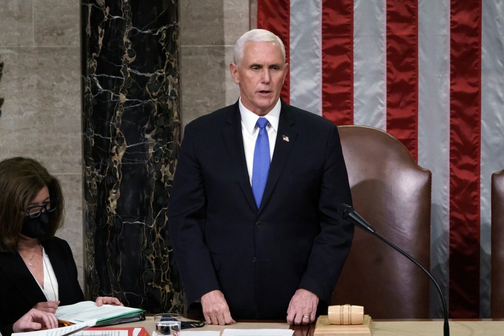 US Vice-President Mike Pence reads the final certification of Electoral College votes at the Capitol on Wednesday. Photo: Reuters