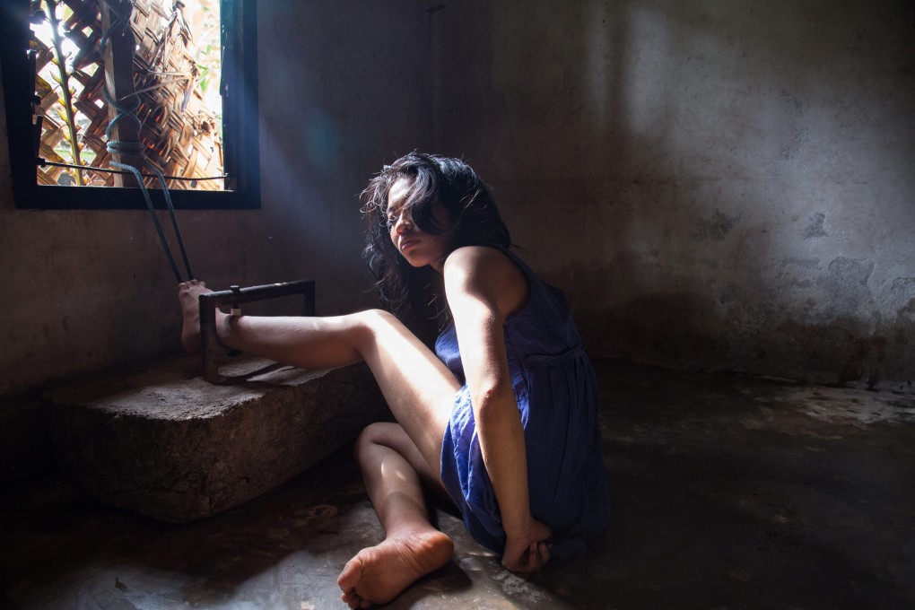 A photo taken on February 5, 2016 shows Kadek shackled in her home. Photo: Suryani Institute for Mental Health / Rudi Waisnawa