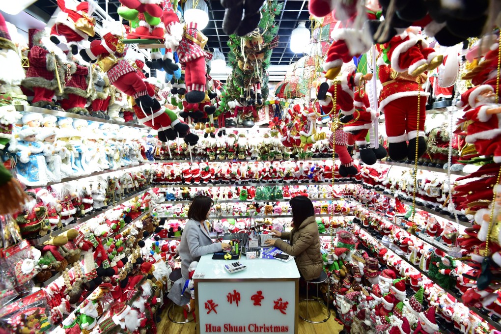 Women sit in a store selling Christmas products at the Yiwu Wholesale Market in Yiwu, in eastern Zhejiang province, on December 17, 2018. Photo: Reuters