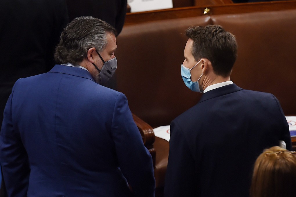 US Senator Ted Cruz speaks with colleague Josh Hawley as electoral votes are counted in Washington on Wednesday. Photo: AFP
