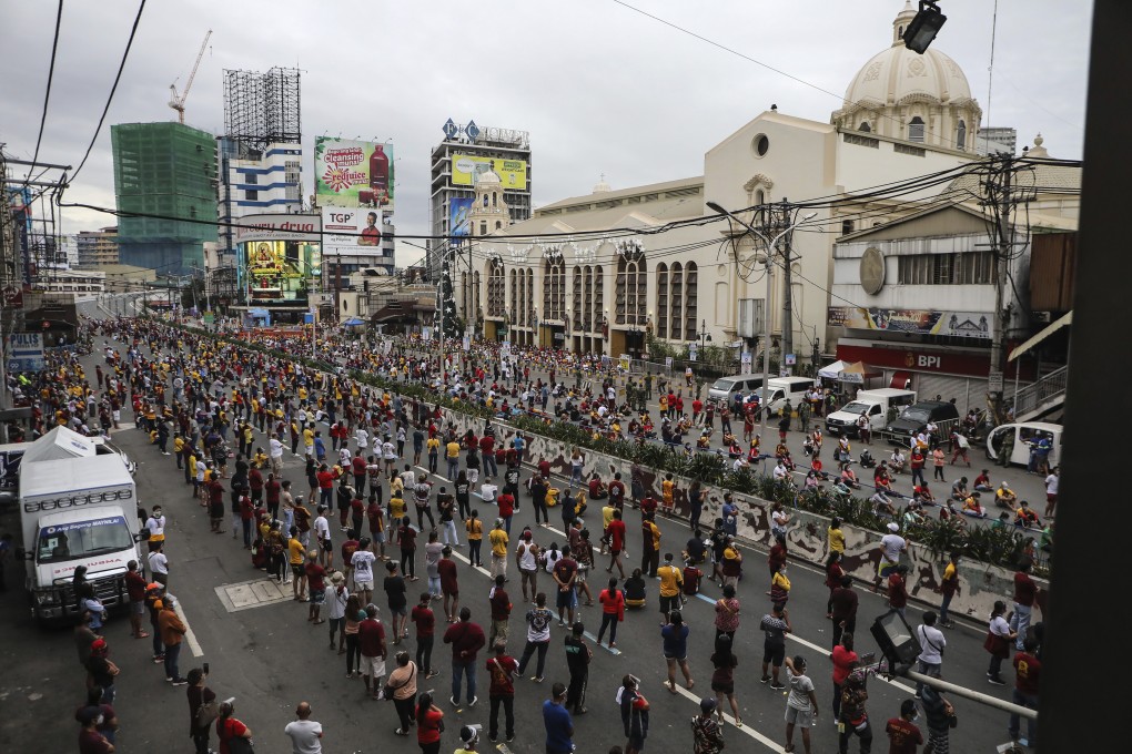 Thousands of Catholic devotees line up as they celebrate the feast day of the Black Nazarene at the Minor Basilica in downtown Manila, Philippines. Photo: AP