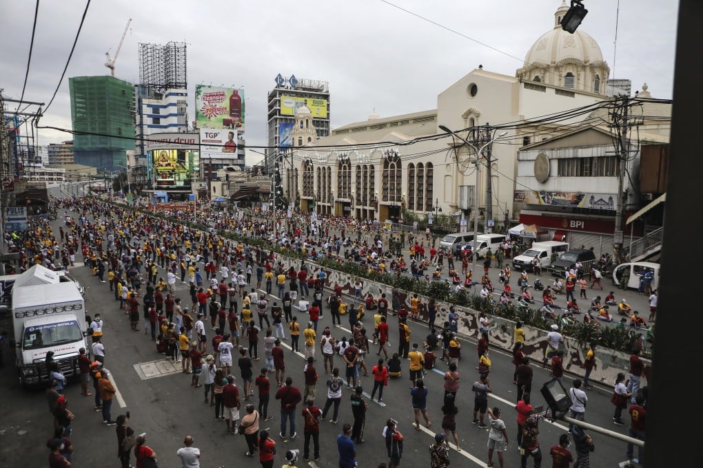 Thousands of Catholic devotees line up as they celebrate the feast day of the Black Nazarene at the Minor Basilica in downtown Manila, Philippines. Photo: AP
