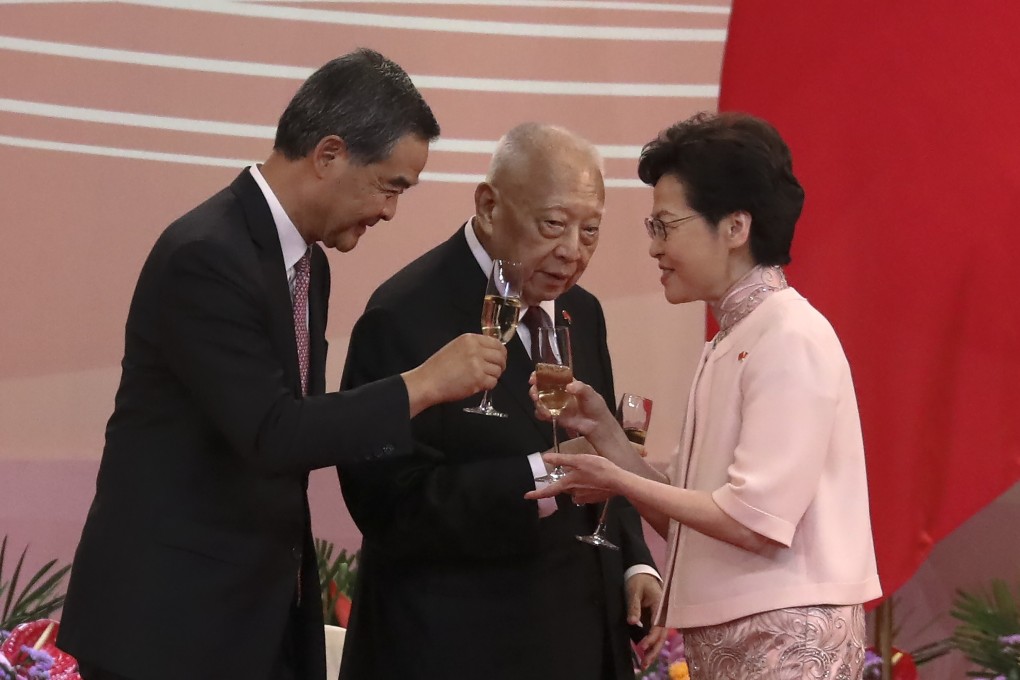 Chief Executive Carrie Lam (right) clinks her glass with former chief executives Leung Chun-ying (left) and Tung Chee-hwa at the reception for the 23rd anniversary of the establishment of the Hong Kong Special Administrative Region, at the Convention and Exhibition Centre in Wan Chai on July 1, 2020. Photo: K.Y. Cheng