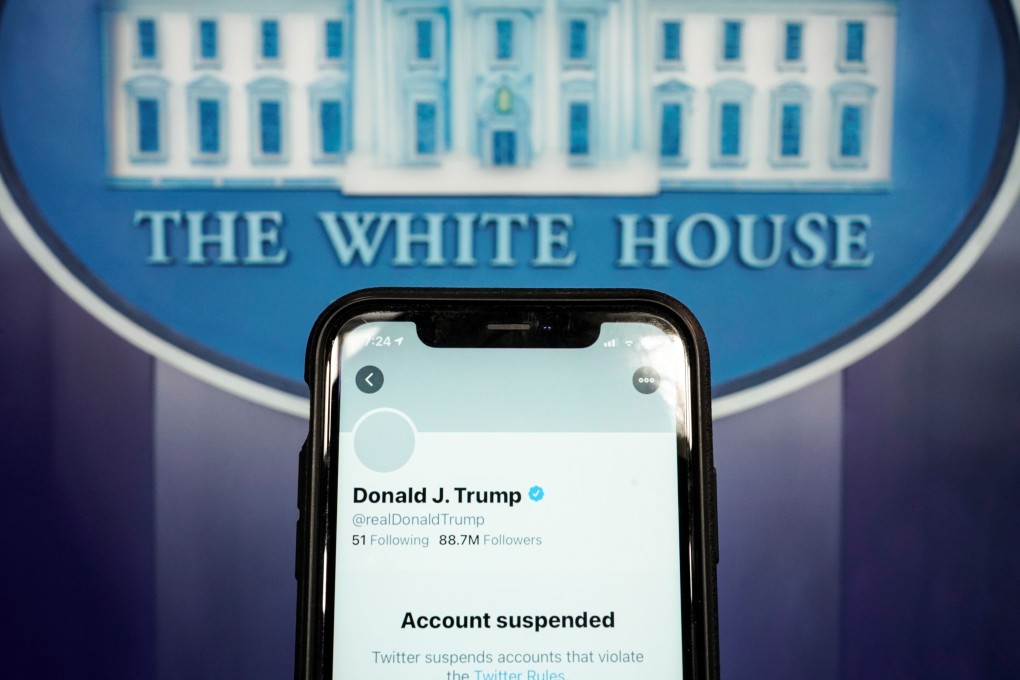 The suspended Twitter account of US President Donald Trump appears on a smartphone screen at the White House briefing room in Washington. Photo: Reuters