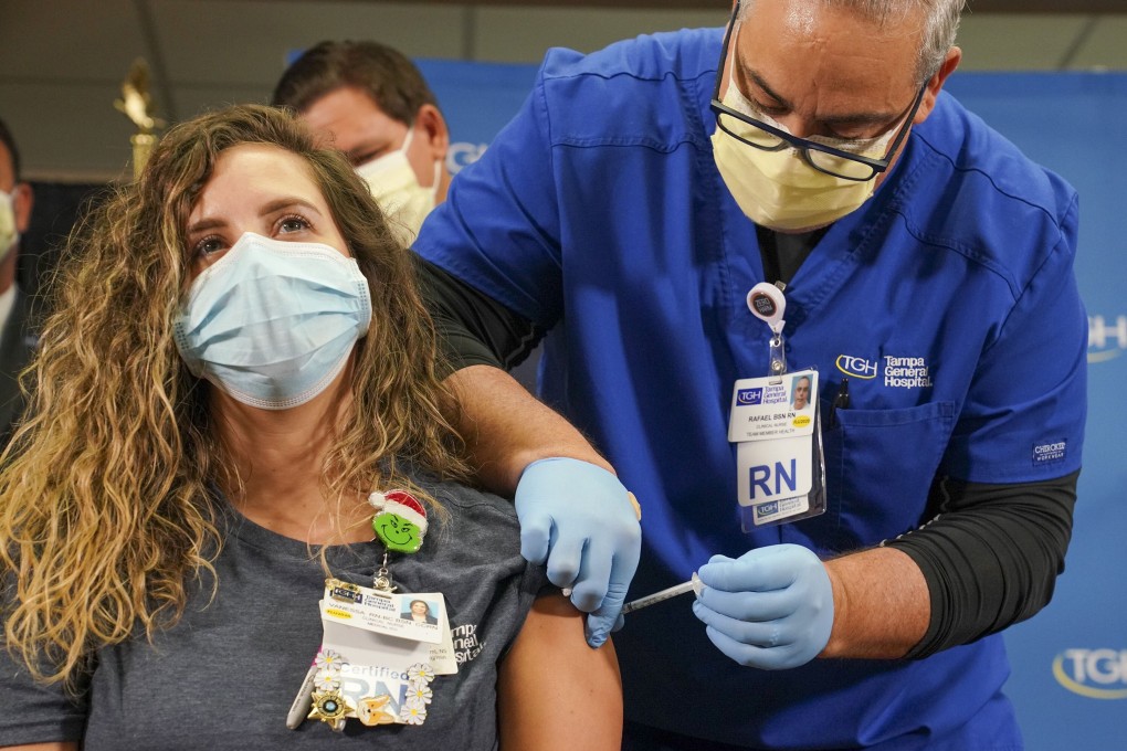 Nurse Vanessa Arroyo receives a Covid-19 vaccine at Tampa General Hospital in Florida on December 14. Photo: TNS