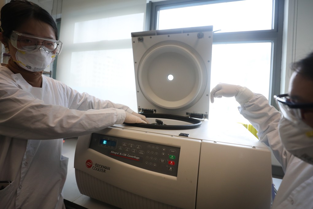 Researchers place a sewage sample on a centrifuge device. Photo: Xiaomei Chen