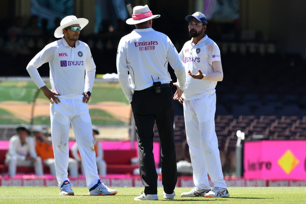 India’s Mohammed Siraj (right) speaks to the umpire as the game was halted after alleged racist abuse from spectators inside the Sydney Cricket Ground on Saturday. Photo: AFP