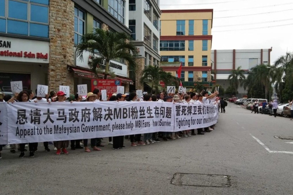 Scores of Chinese nationals demonstrate outside their embassy in Malaysia in 2019 claiming they lost their life savings to Teow’s MBI group. Photo: Irene Andy / Facebook