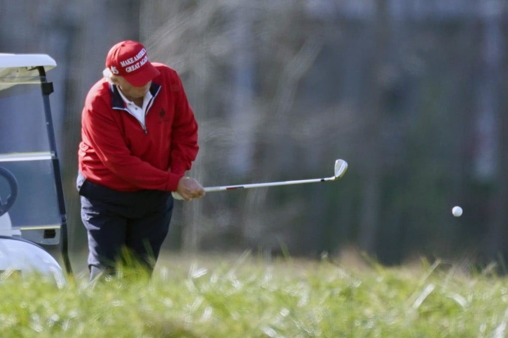 US President Donald Trump plays golf at Trump National Golf Club in Sterling, Virginia. Photo: AP