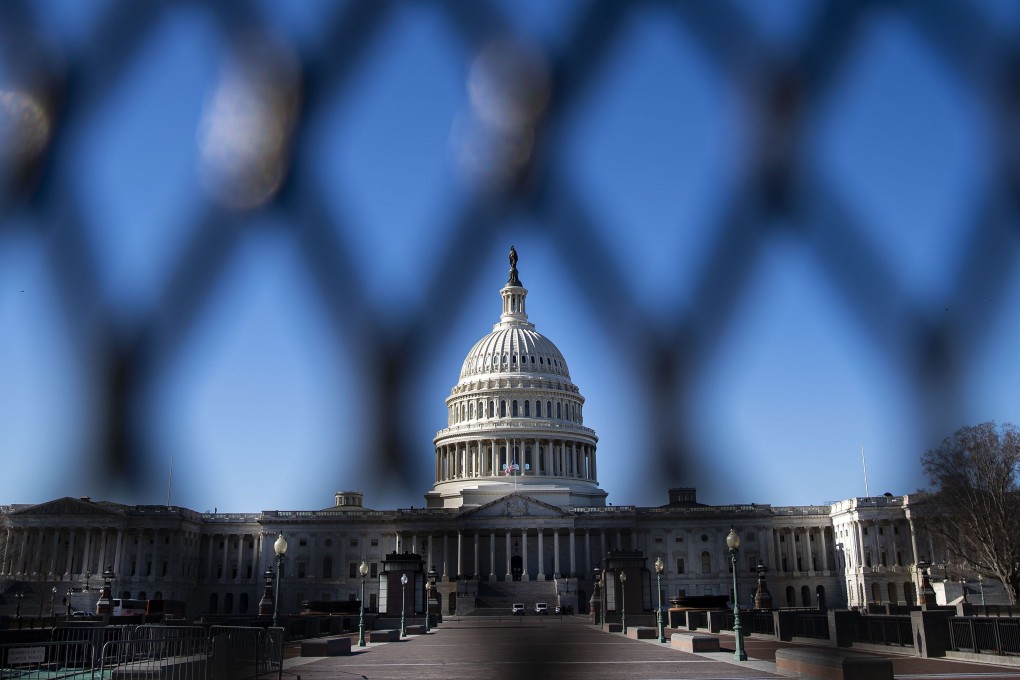 The US Capitol is seen behind security fencing on Sunday. Pro-Trump protesters had stormed the building just days before. Photo: AFP
