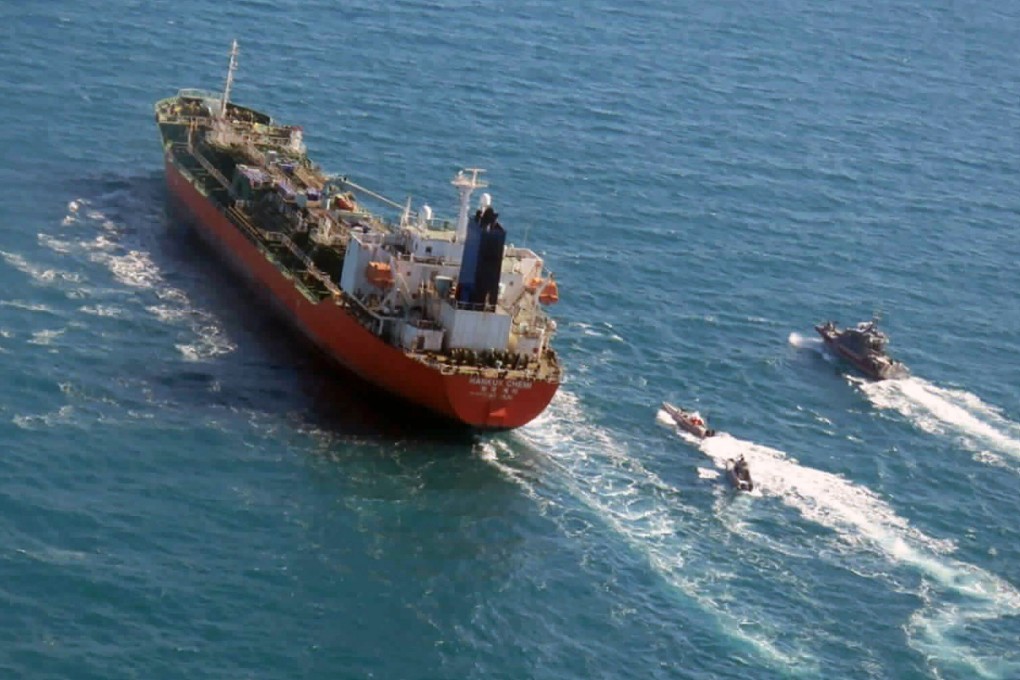 A seized South Korean-flagged tanker is escorted by Iranian Revolutionary Guard boats on the Persian Gulf. Photo: Tasnim News Agency via AP