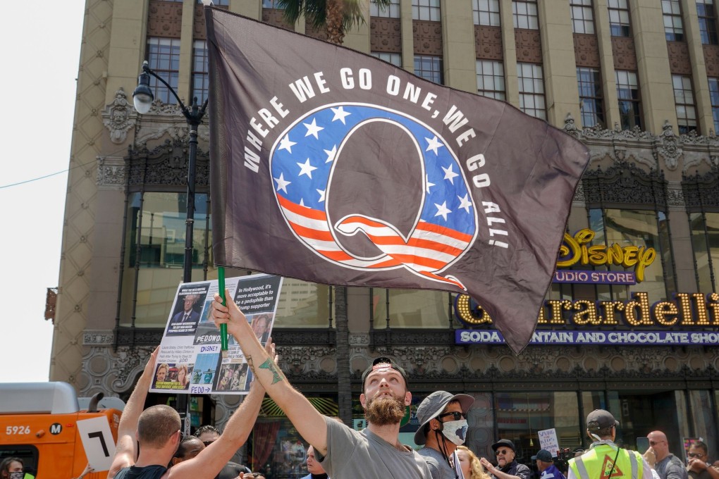 The QAnon conspiracy theory claims Donald Trump is waging a secret war against a global liberal cult of Satan-worshipping paedophiles. Photo: AFP