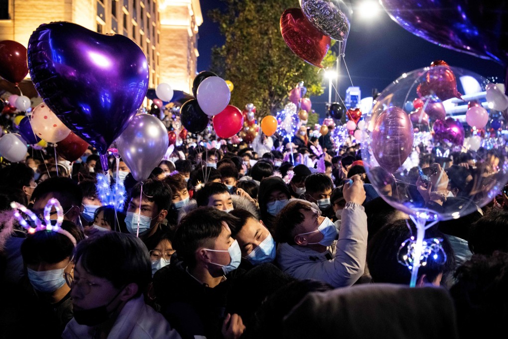 People celebrating the New Year's countdown in Wuhan in central Hubei province on December 31. The Hang Seng Index is within 1 per cent of erasing all of the losses triggered by the Wuhan lockdown a year ago. Photo: AFP