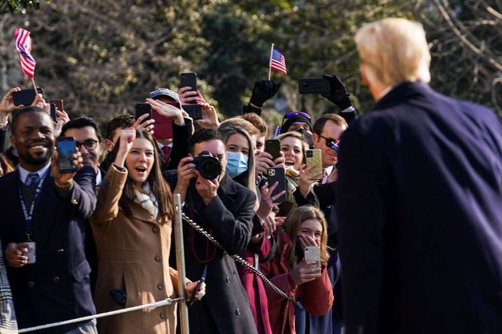 US President Donald Trump greets supporters as he departs the White House to visit the US-Mexico border wall in Texas on January 12, 2021. Photo: Reuters