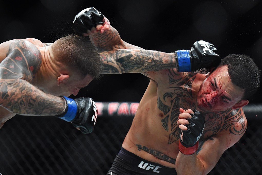 Max Holloway trading blows with Dustin Poirier at UFC 236. Photo: AFP