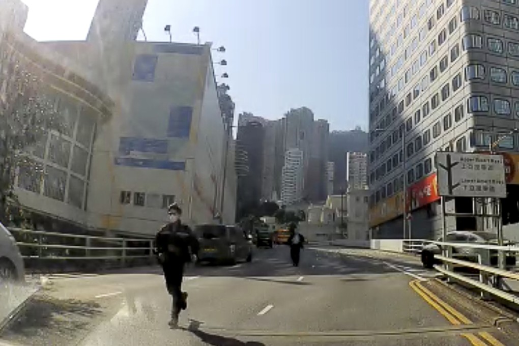 Dashcam footage shows officers racing downhill after an empty police van rolled backward for about 100 metres on Wednesday, hitting three other vehicles. Photo: Facebook