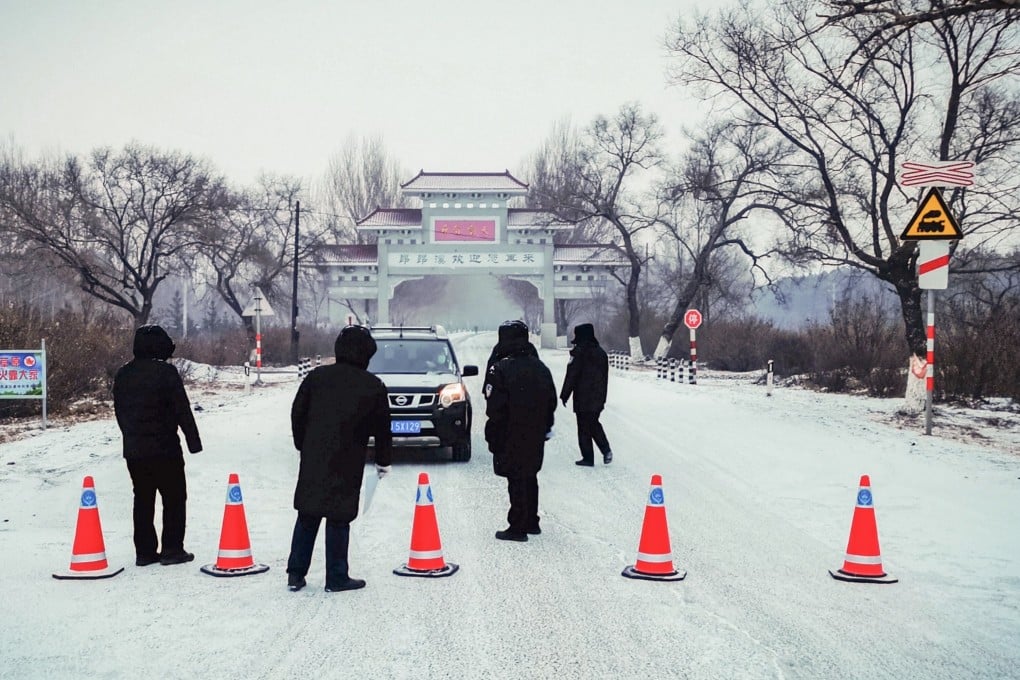 A car is stopped from leaving a district of Heilongjiang after a state of emergency was declared on Tuesday. Photo: AFP