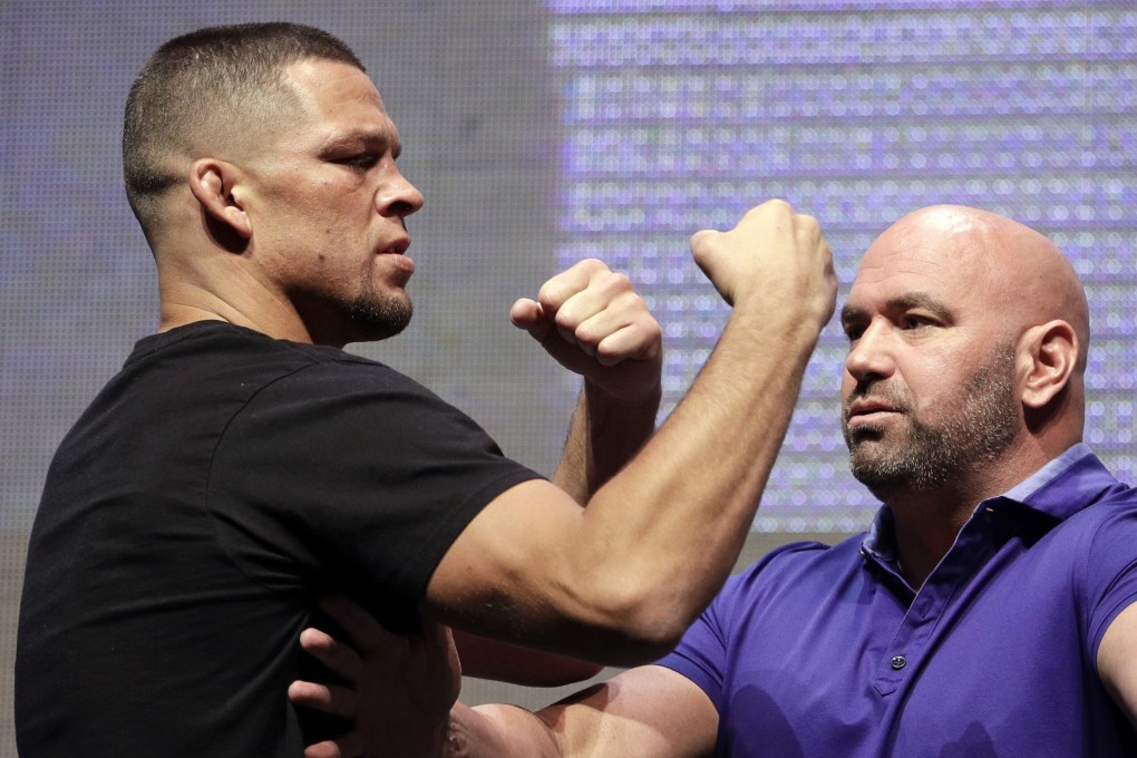 UFC president Dana White stands between Nate Diaz and Conor McGregor at a UFC 202 pre-fight press conference in Las Vegas, Nevada in 2016. Photo: AP